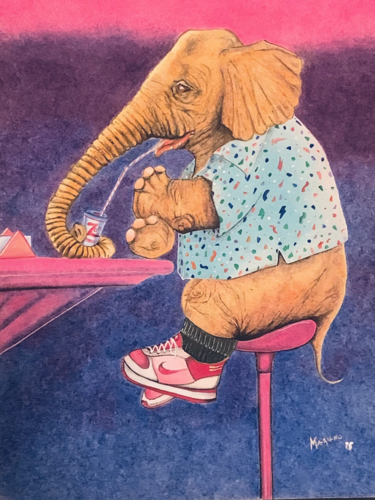 An elephant in a patterned shirt and red-and-white sneakers sits on a pink stool drinking through a straw.